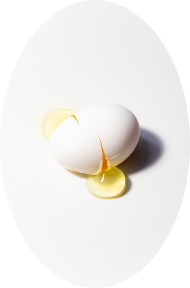 A broken egg with egg white coming out
