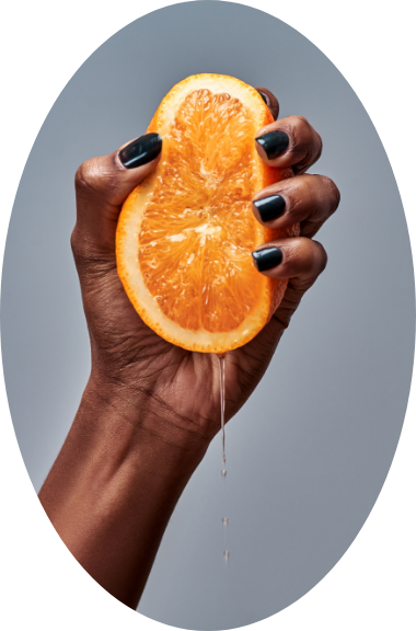 An orange in a girl's hand