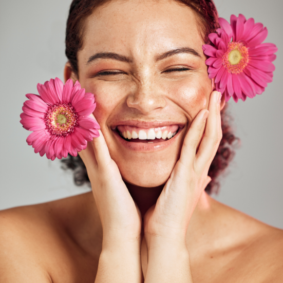 smiling girl with Italcosmetici's makeup and pink flower around her face