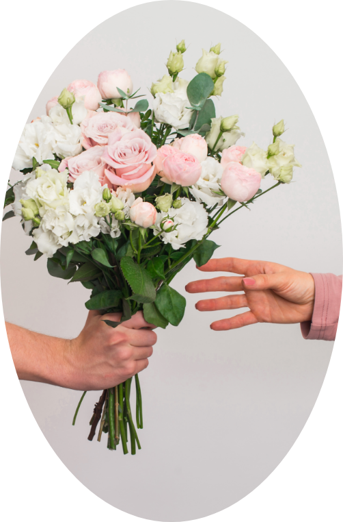 Hand grabbing a bouquet with colorful flowers
